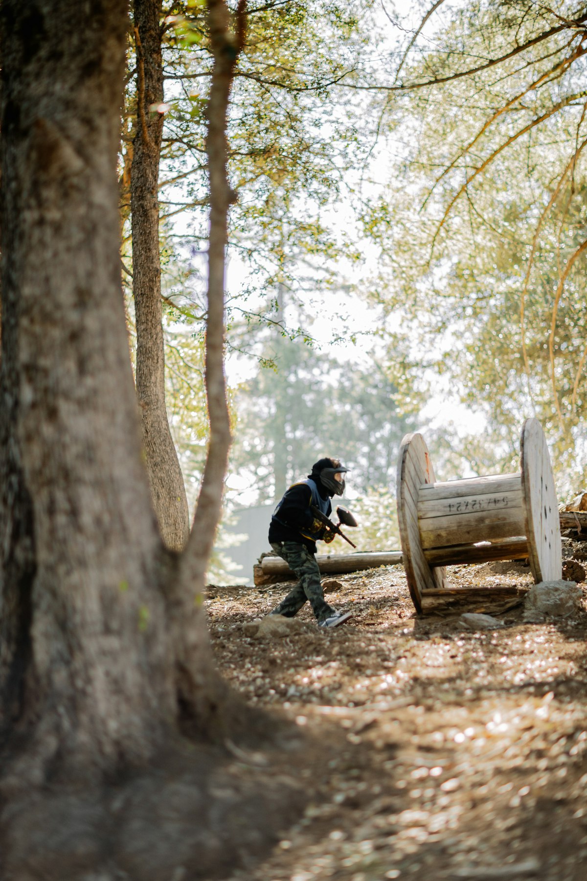 Paintball player in protective equipment